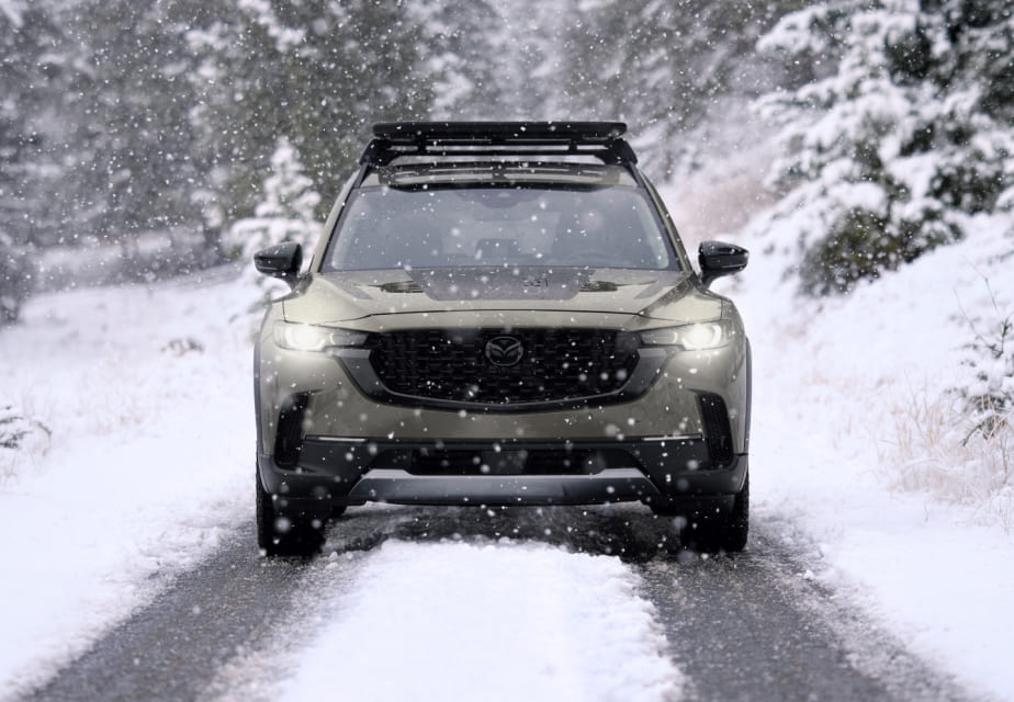 2026 Mazda CX-50 driving in snowy conditions