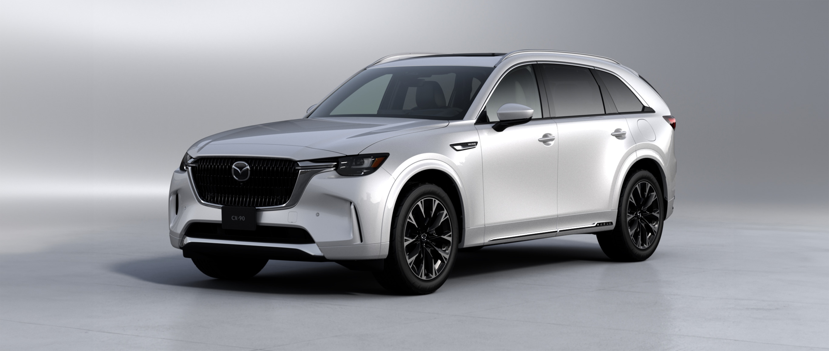 White 2026 Mazda CX-90 shown from the front three-quarter angle