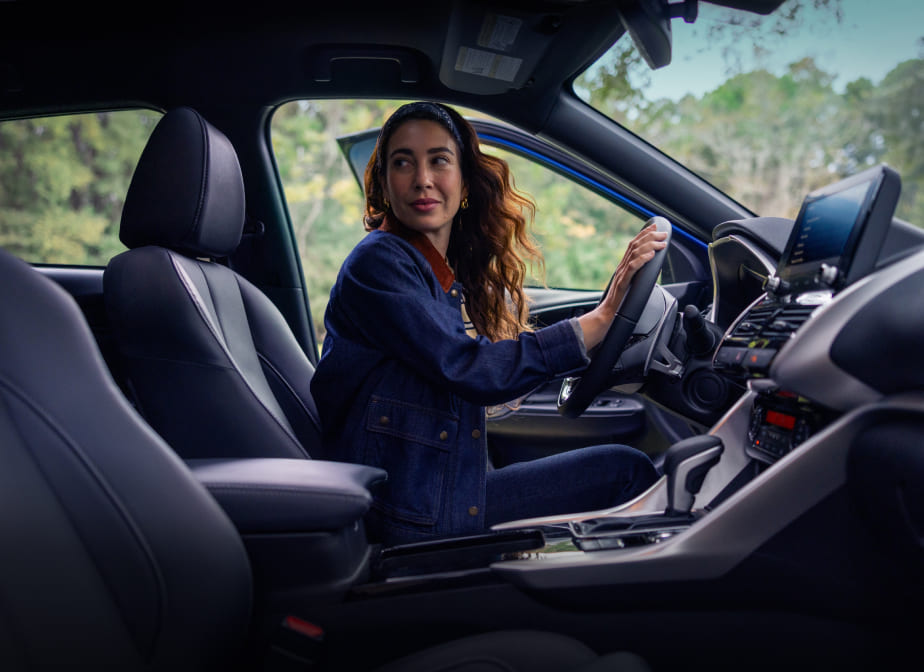 Driver in the front cabin of a Mitsubishi Eclipse Cross